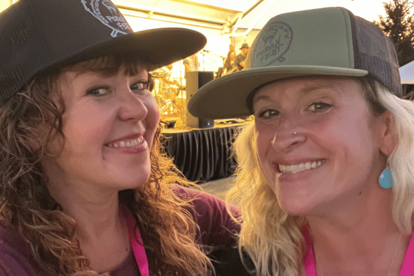 Porchfest attendees smiling in front of a stage